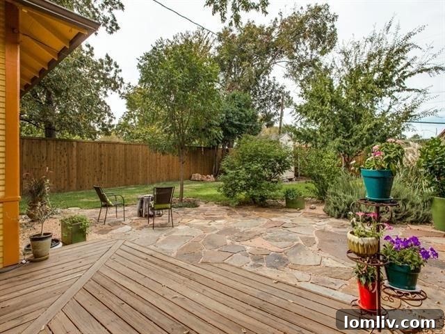 Charming backyard with wood deck and stone patio at 121 S. Clinton Ave.