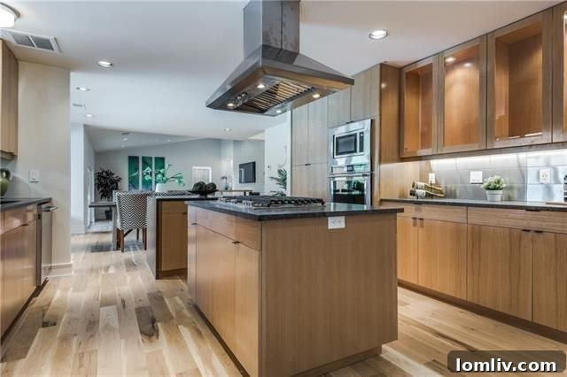 Gourmet kitchen with rift-cut white oak cabinets and large island.