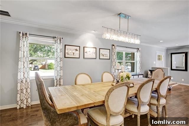 Modern kitchen with large island, quartz countertops, and pot filler.