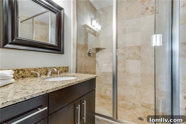 Close-up of the kitchen's granite countertops and stone backsplash