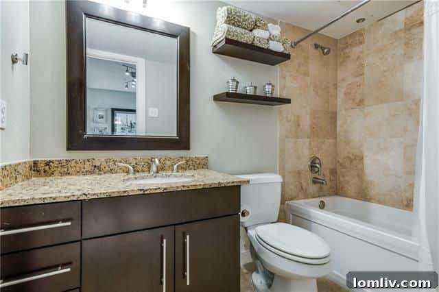 Laundry room area with washer and dryer hookups, adjacent to the kitchen