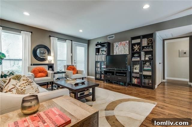 Modern kitchen with granite countertops, stainless steel appliances, and breakfast bar