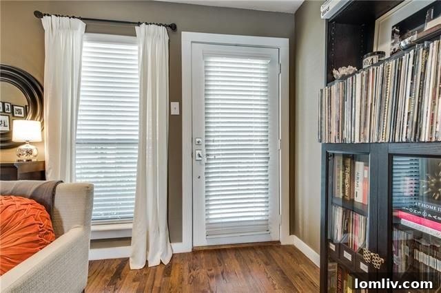 View of the dining area and the see-through stone fireplace from the living room