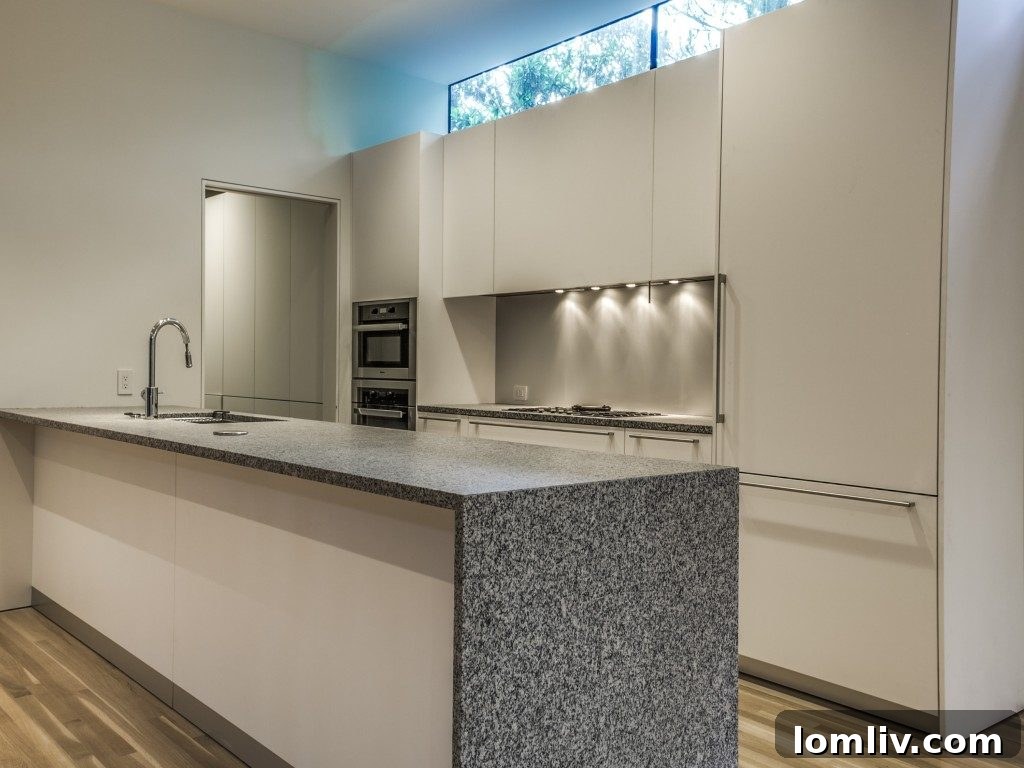 Contemporary Kitchen with Miele Appliances and Waterfall Granite