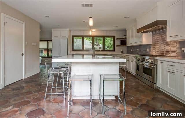 Modern Kitchen with Saltillo floors and quartz countertops