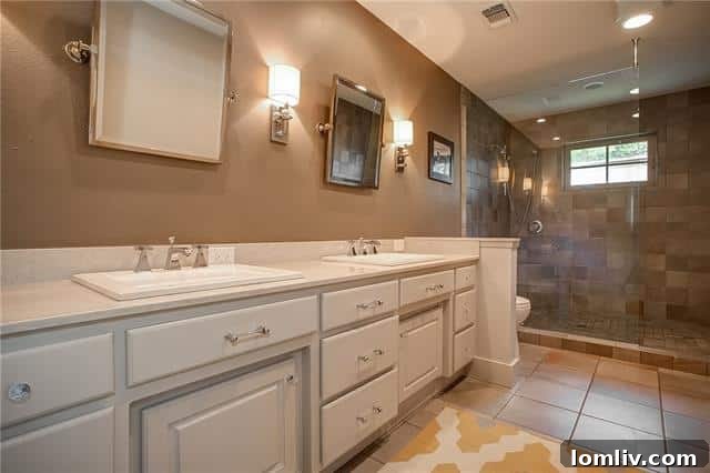 Fenced backyard with grassy play space and hardscape