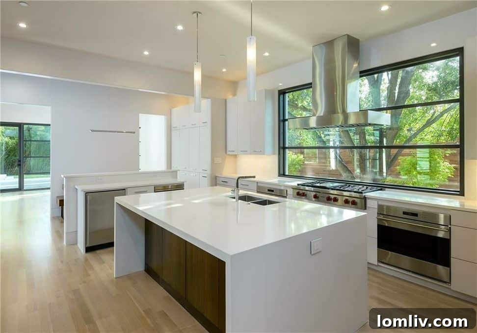 Modern kitchen island and dining area in 4920 Mangold Circle