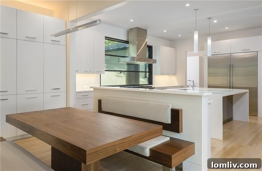 Kitchen with large window behind the gas stove, enhancing natural light