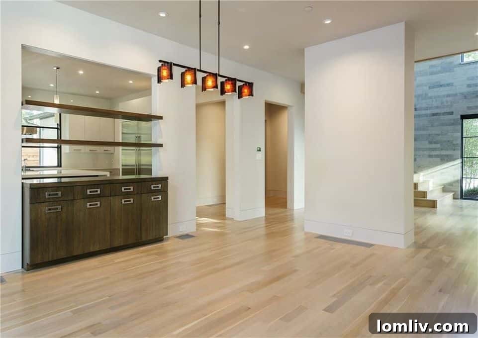 Elegant dining room with modern chandelier and ample natural light