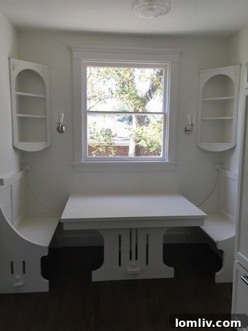 Modern kitchen featuring subway tile, gray marble surfaces, and a beautifully restored vintage Chambers stove