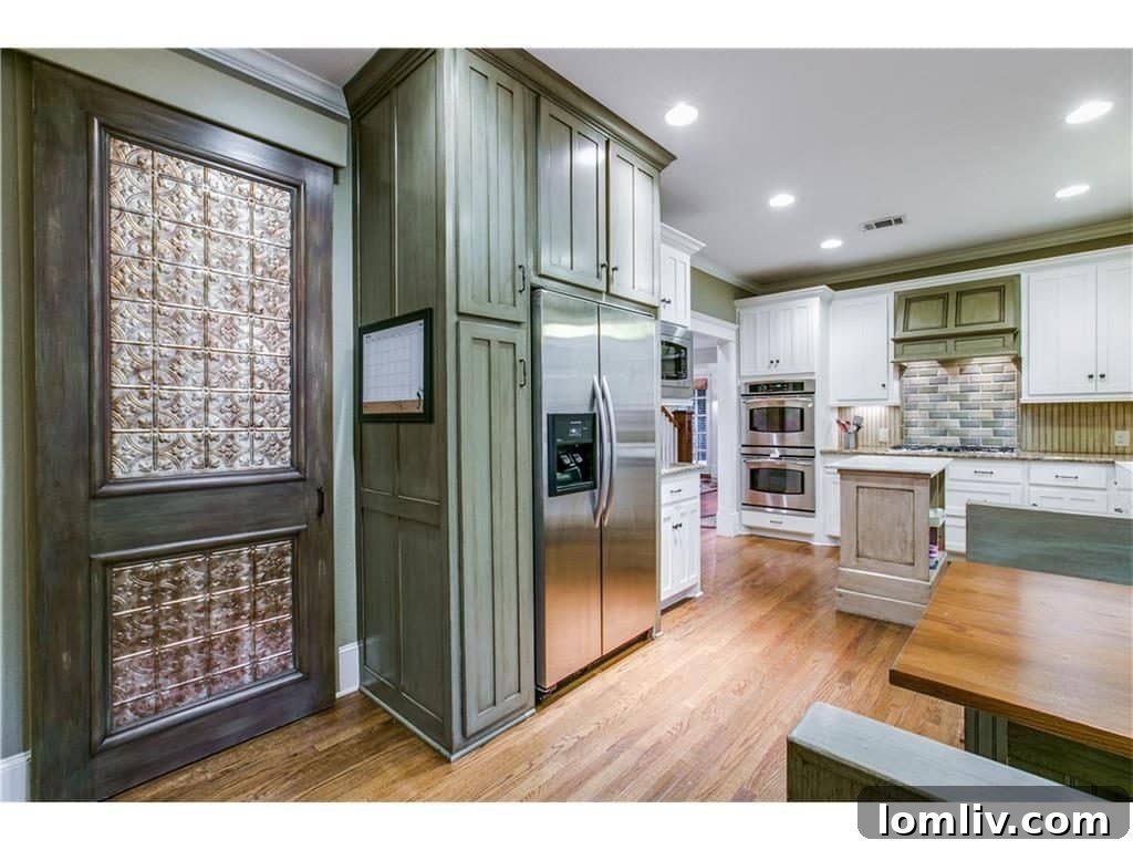 Hidden pantry door revealing extensive storage
