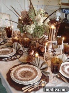 Elegant Thanksgiving tablescape with elevated dried hydrangeas and pheasant feathers