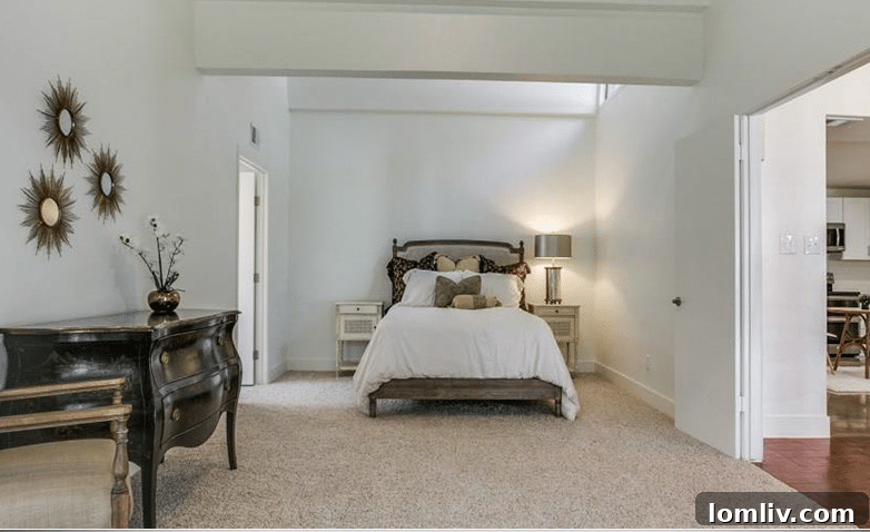 Luxurious Master Bathroom with Modern Cabinetry and Floating Mirrors