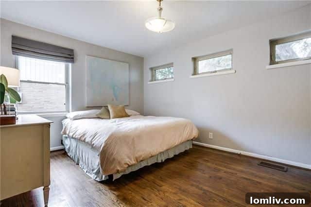 Covered patio in the backyard with green space