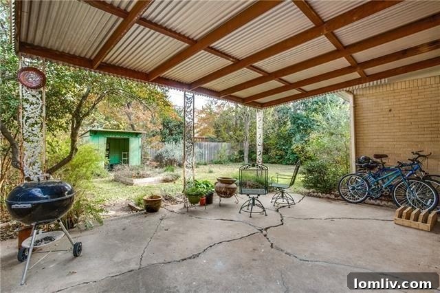 Rear exterior view of the house and backyard