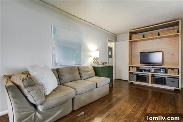 View of the kitchen with cream cabinets and stainless steel appliances