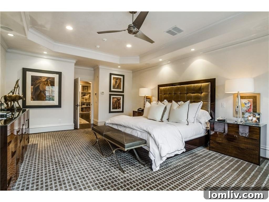Elegant master bedroom with plush furnishings and sophisticated design