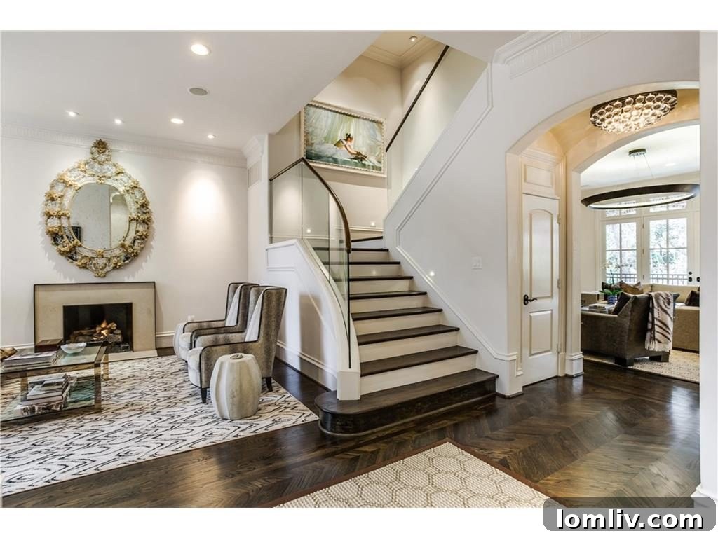 Interior view of a modern luxury home staircase with glass panels