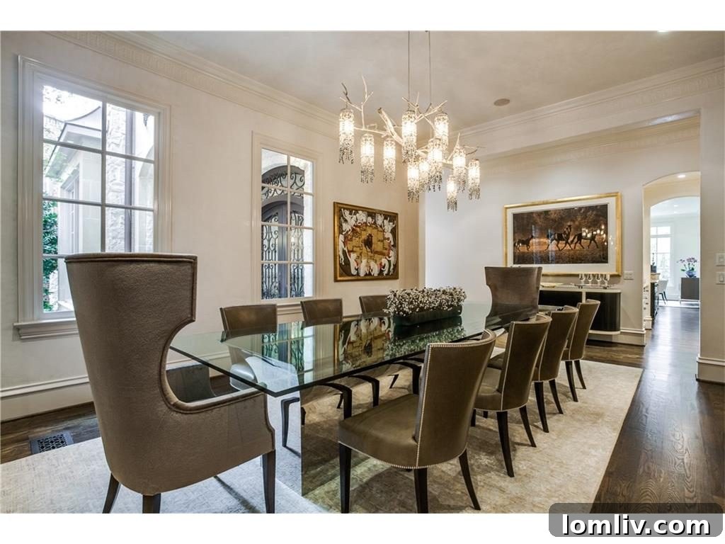 Elegant dining area featuring Allen Knight light fixtures in a University Park home