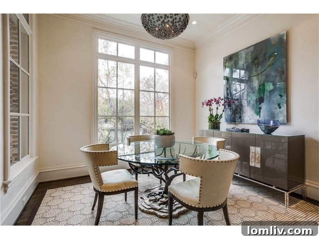 Elegant dining table with an aged iron and rock crystal medallion pendant light