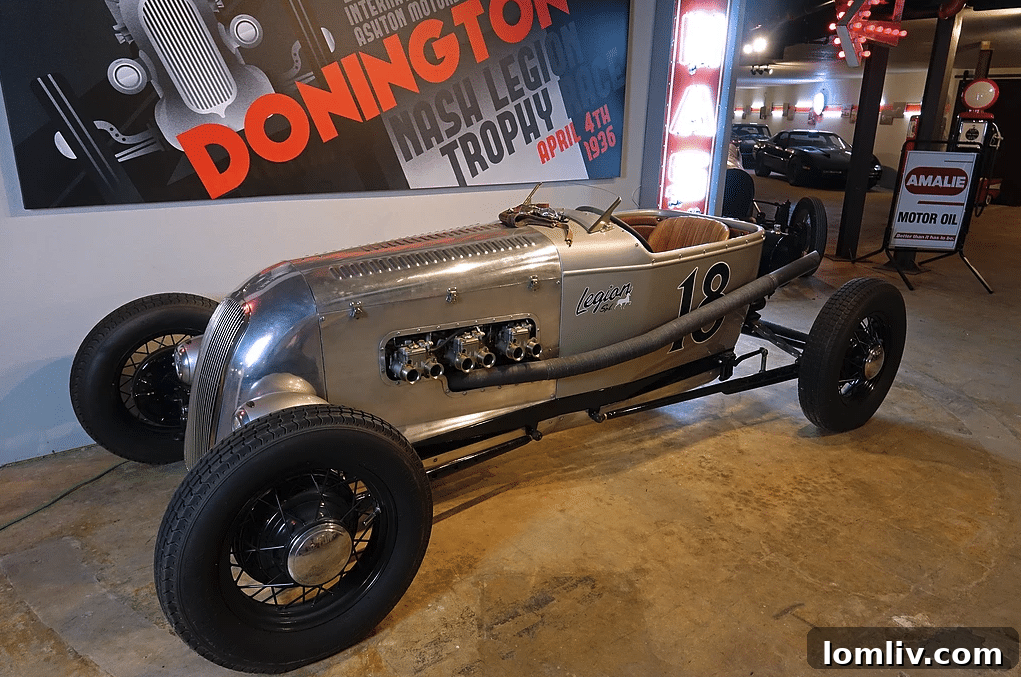 Historic racing cars and vintage automobiles in collector's garage