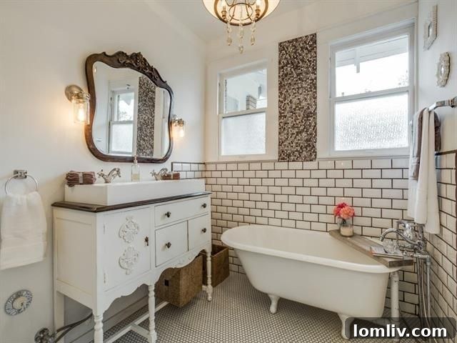 Dallas Open House Spotlight: A Masterpiece Craftsman in Junius Heights 17 Updated bathroom with penny tile and clawfoot tub at 611 N. Montclair Ave