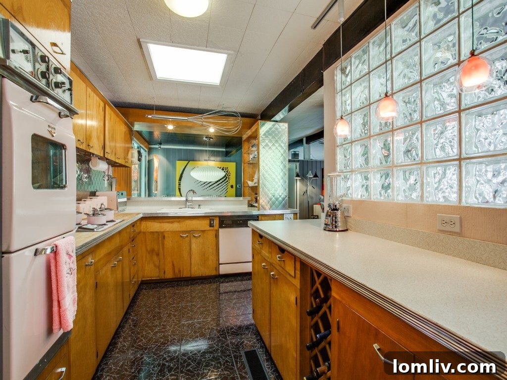 Detailed view of the turquoise bathroom tiling, showcasing retro elegance.