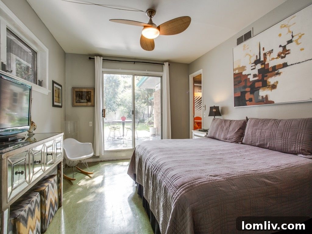 View of the covered lanai from the pool area, highlighting indoor-outdoor flow.