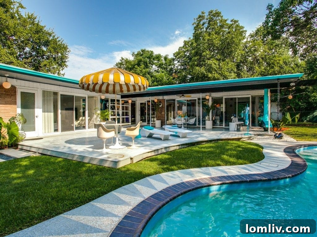 Interior view showcasing the open plan and curated Mid-Century Modern decor.