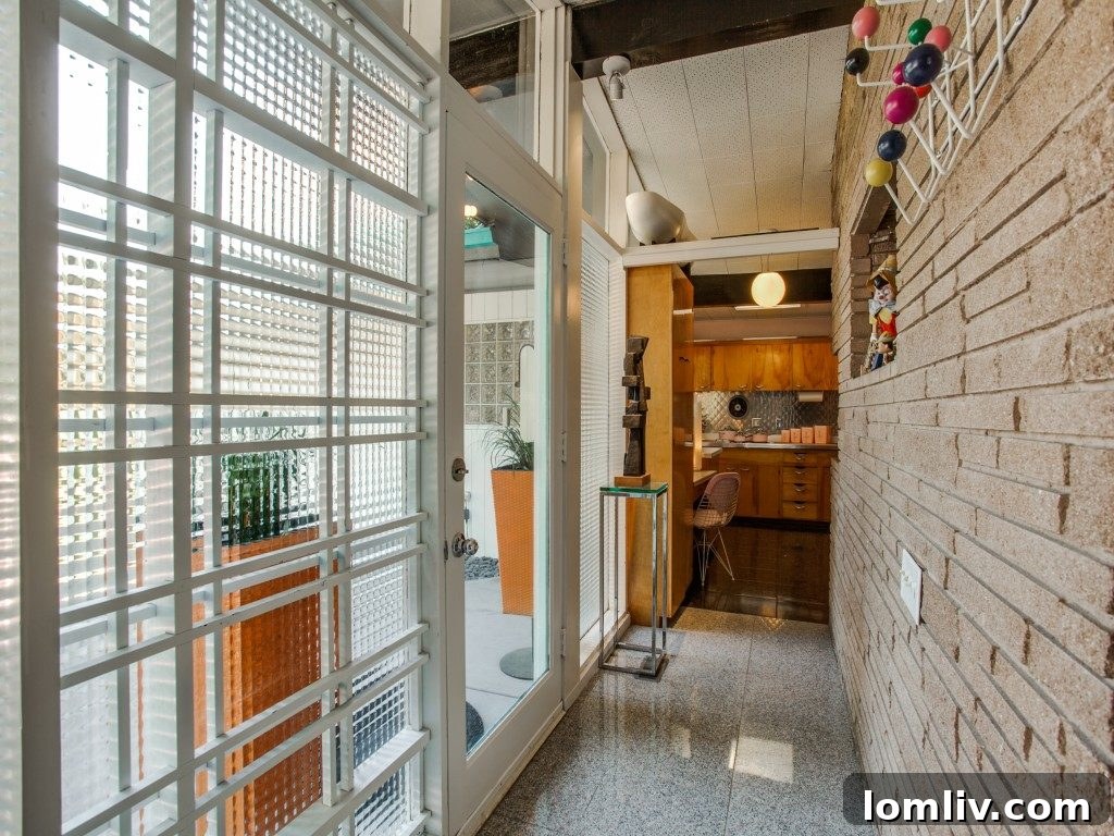 Mid-Century Modern exterior with lush landscaping, offering curb appeal.