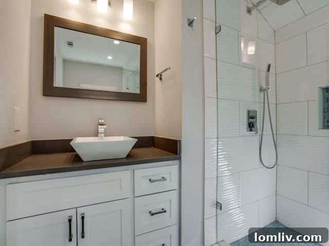 Interior view showcasing continuous hardwood floors and recessed lighting