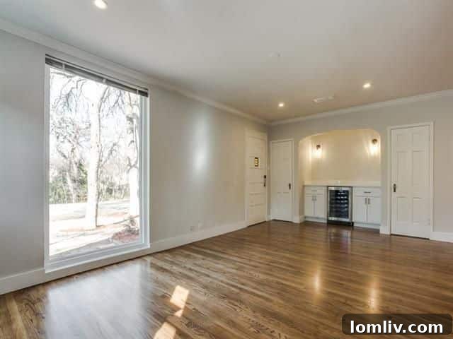 Open concept living area showcasing hardwood floors and modern design