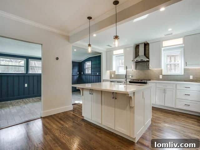 Renovated kitchen with quartz island in Oak Cliff home