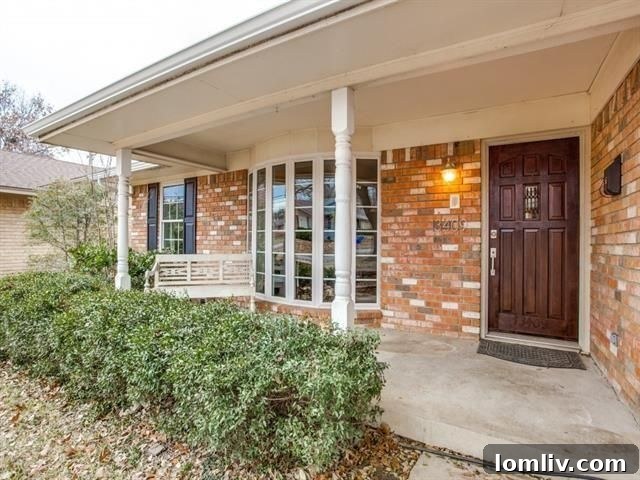 Spacious Formal Dining Area Featuring Crown Moulding and Chic Chandelier