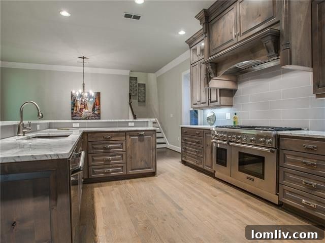 Gourmet Kitchen with Large Island and Custom Cabinetry at 6350 Belmont Ave
