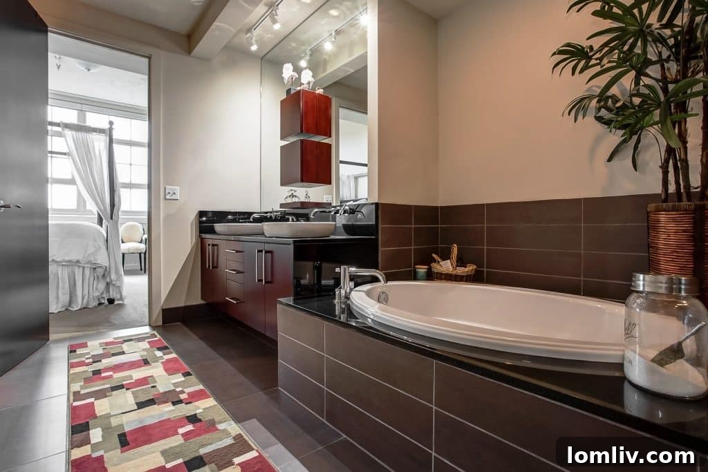 Master bathroom with soaking tub and double vanities in Unit #2450