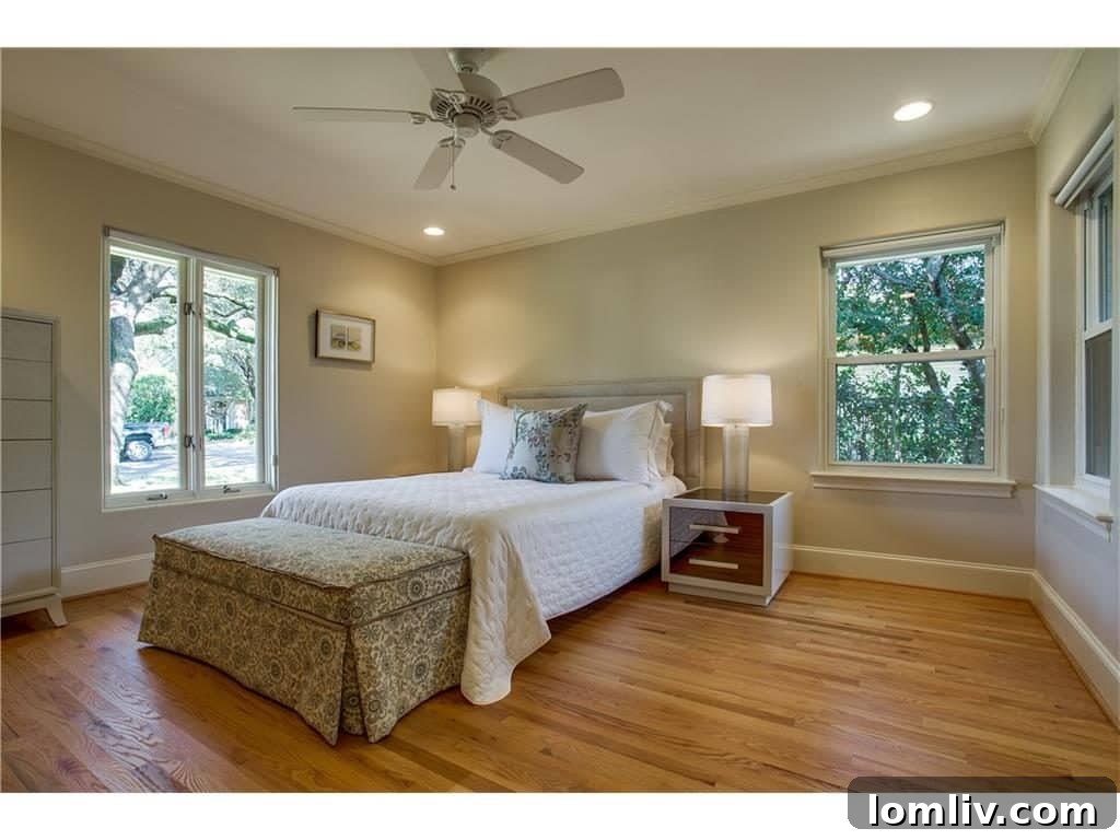 Tastefully decorated master bedroom offering comfort and natural light