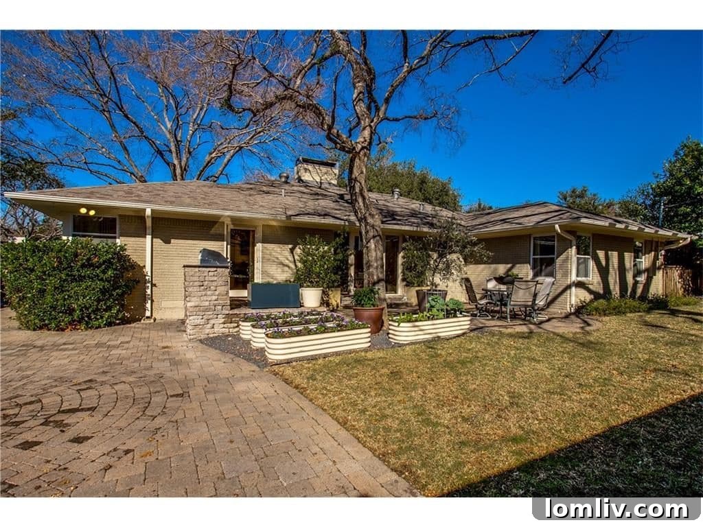 View of the expansive green lawn in the private backyard of the Mockingbird Park home