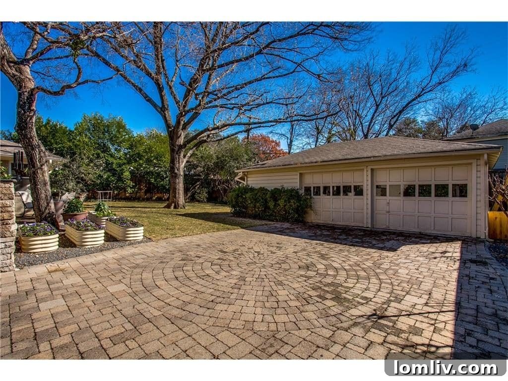Overall shot of the inviting backyard, showcasing the patio and lush landscaping