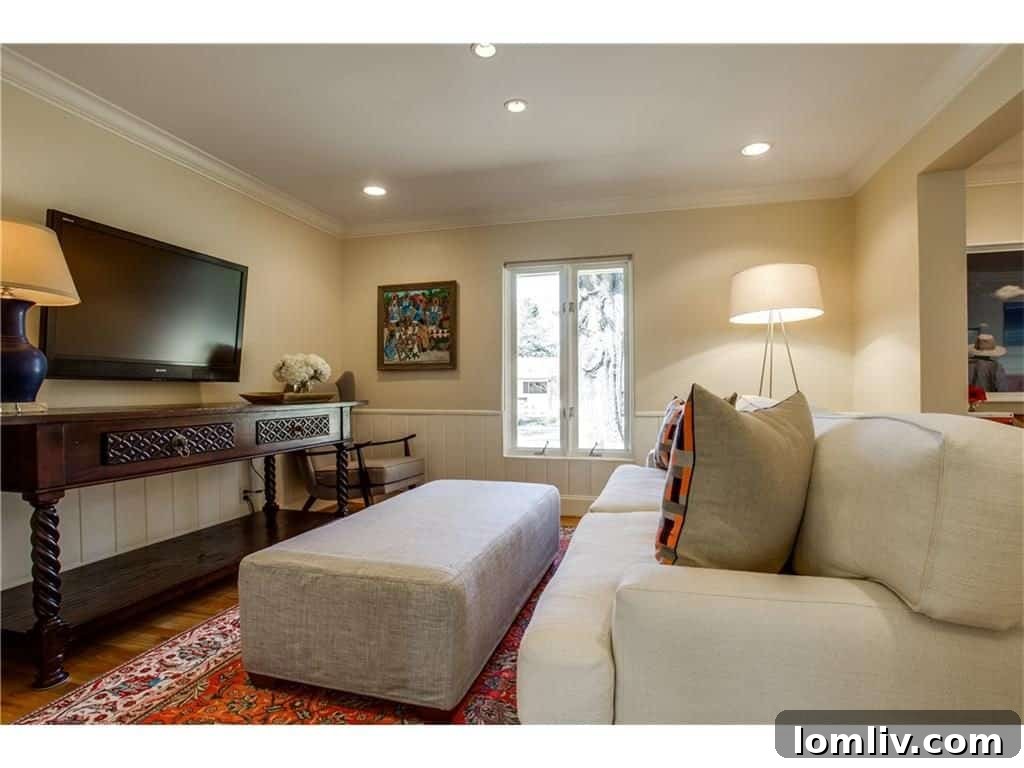 Modern entertainment area, formerly a formal dining room, optimized for TV viewing