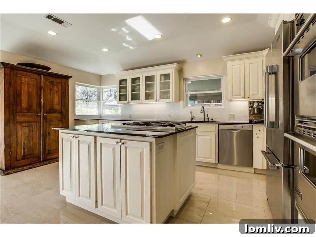 Spacious and well-appointed kitchen with ample storage and counter space
