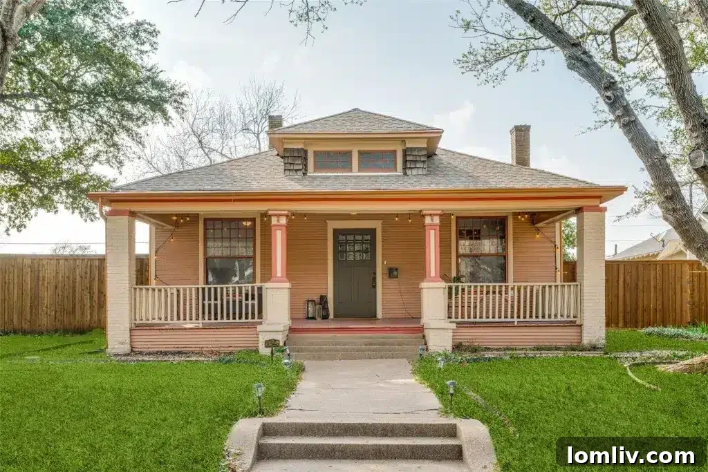 A charming Winnetka Heights Craftsman home with a lush front yard, showcasing traditional architecture and inviting curb appeal.