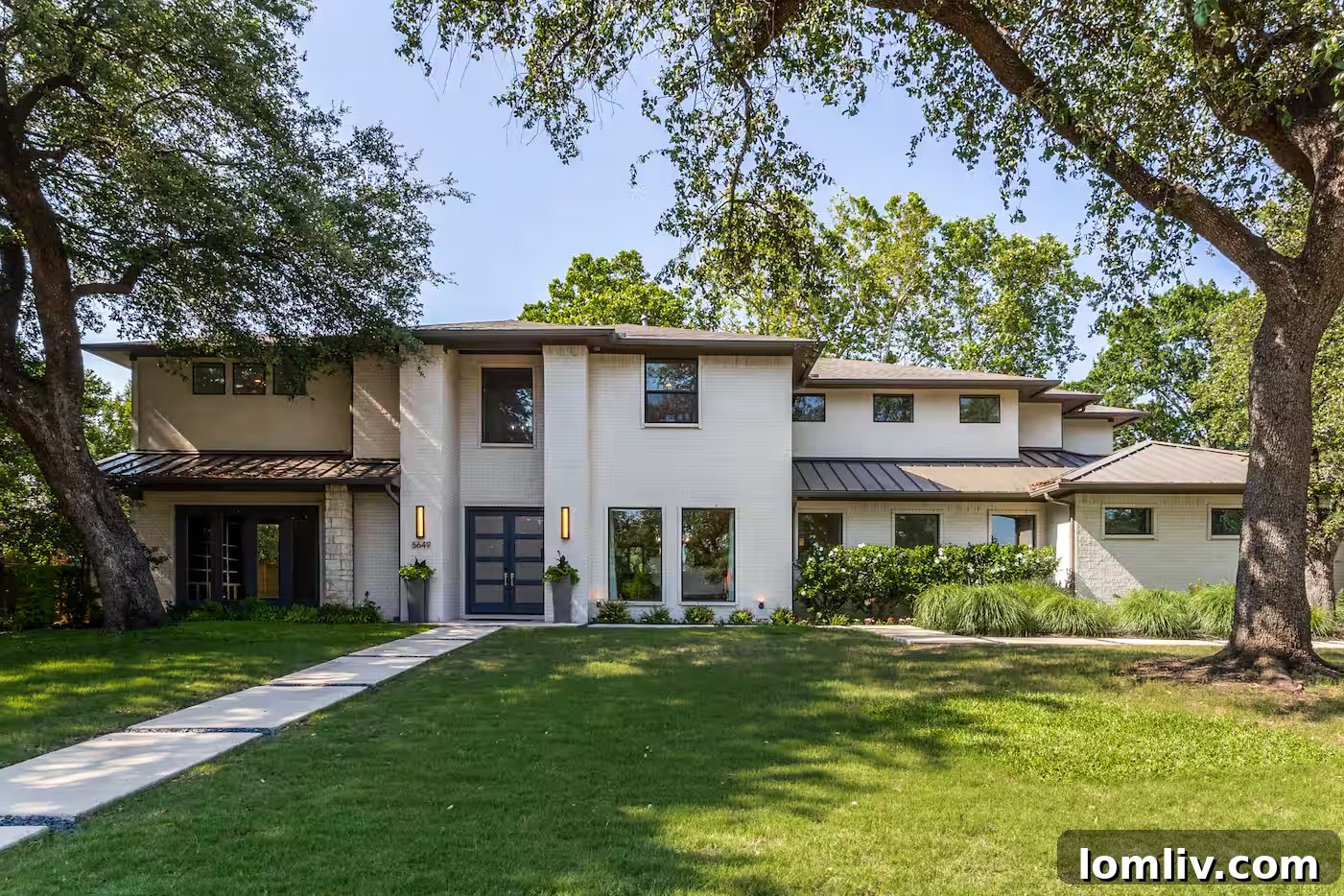 Stunning exterior view of Bryson DeChambeau's luxury Dallas mansion, showcasing modern architecture and manicured landscaping.