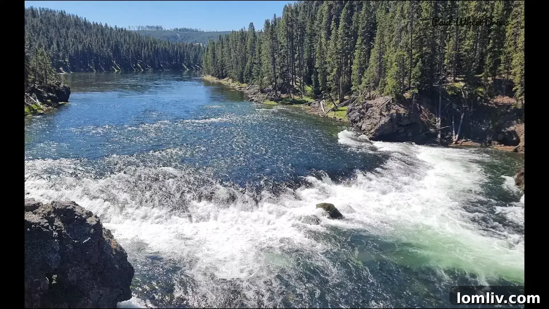 Yellowstone's Grandeur: Explore a Wild Oasis for Nature Enthusiasts 6 Hikers enjoying a scenic view in Yellowstone National Park