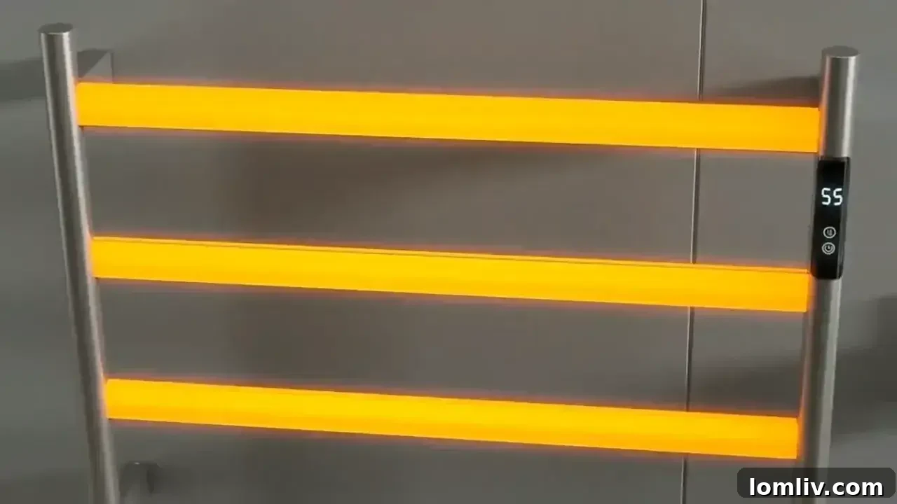 Electric towel rail with a thermostat, illustrating heating power settings