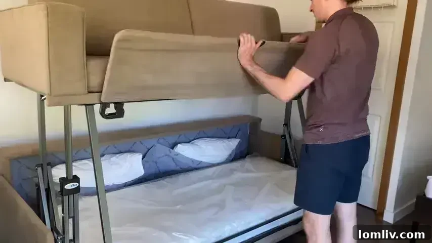 A modern sofa bed serving as both seating and an extra sleeping option in a small apartment.