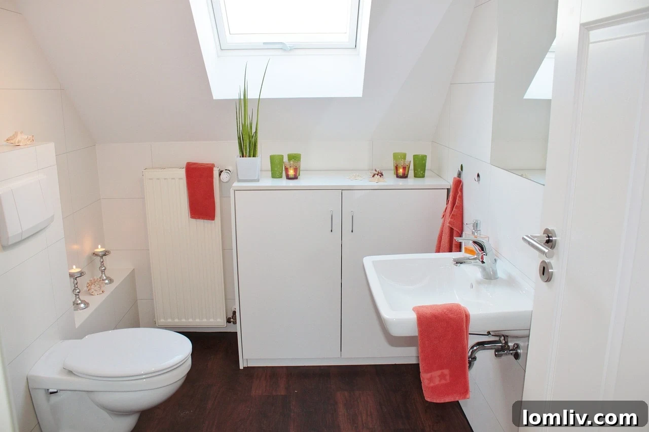 Clean and modern small bathroom with white tiles and wooden accents