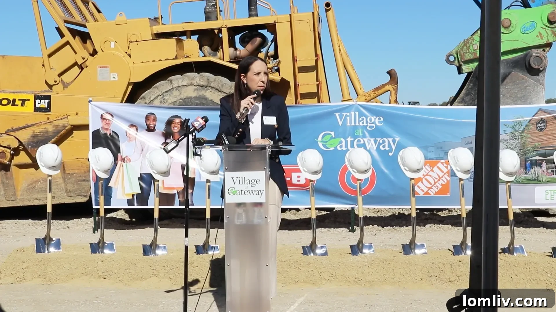 A rendering of The Village at Gateway in Forney, Texas, showcasing a modern retail and commercial center with multiple stores and ample parking, reflecting a major urban development.