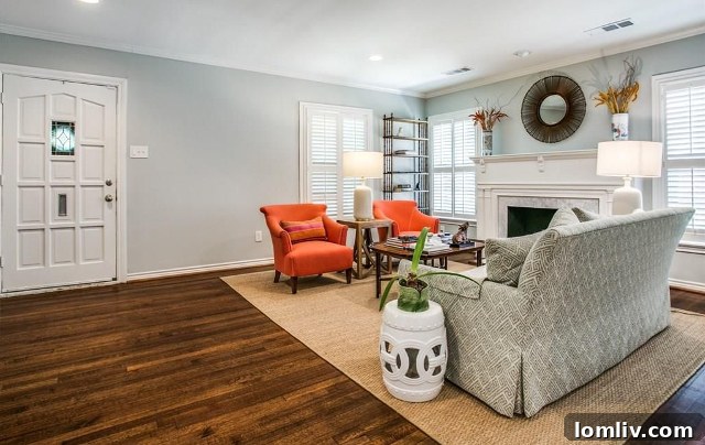 Formal living room at 4433 Hyer Street with a classic fireplace and bright windows