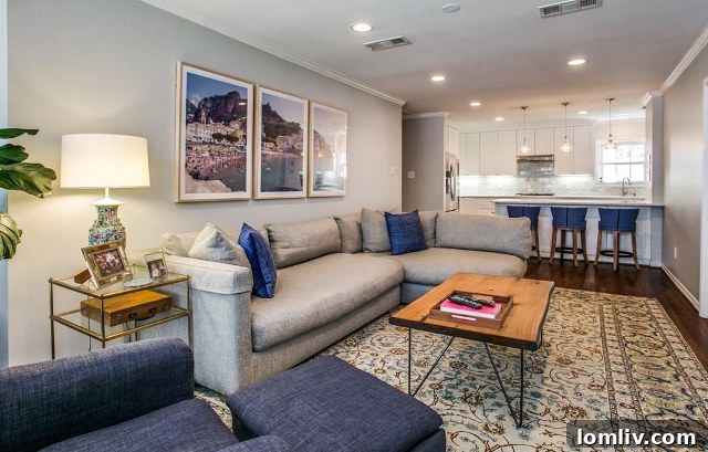 View from the dining room into the flexible living space at 4433 Hyer, showing a large pocket door